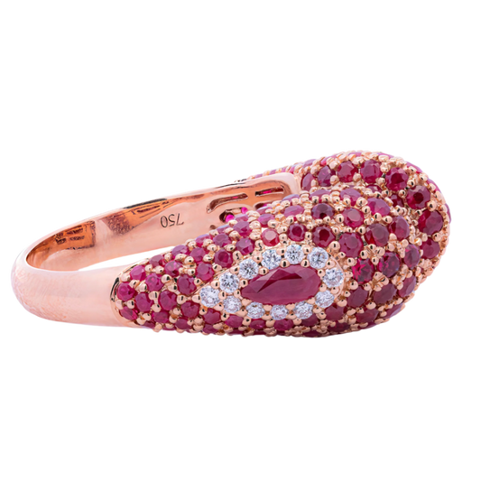 Rose gold ring with red gemstones and diamonds on a white background